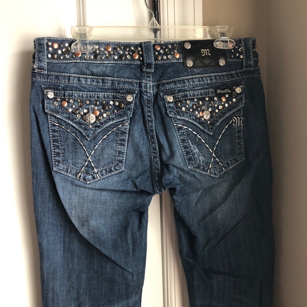 Buckle Miss Me jeans.
